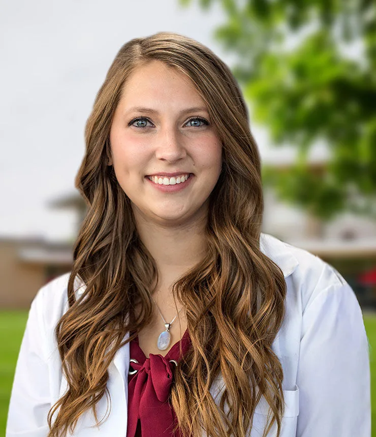 Daniell Evankoman smiling in front of Maryville University